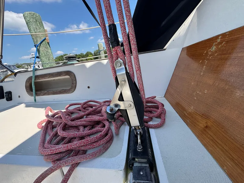Slide: The Image of Sailboat deck with ropes and hardware, Bristol 33.3, 1988 model, under clear blue sky. - 30