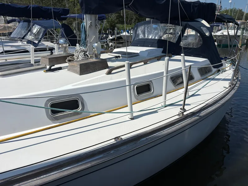 Slide: The Image of 1988 Bristol 33.3 sailboat docked, featuring sleek design and classic nautical elements. - 5