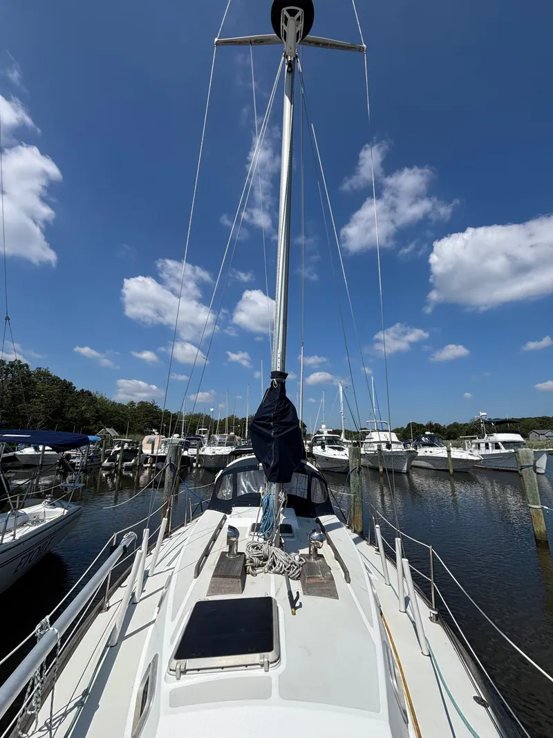 Slide: The Image of Sailboat docked in marina, clear sky, Bristol 33.3, 1988 model. - 8
