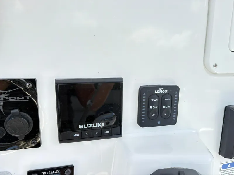 Slide: The Image of Control panel of 2022 Aquasport 2300 CC with Suzuki and Lenco displays. - 11