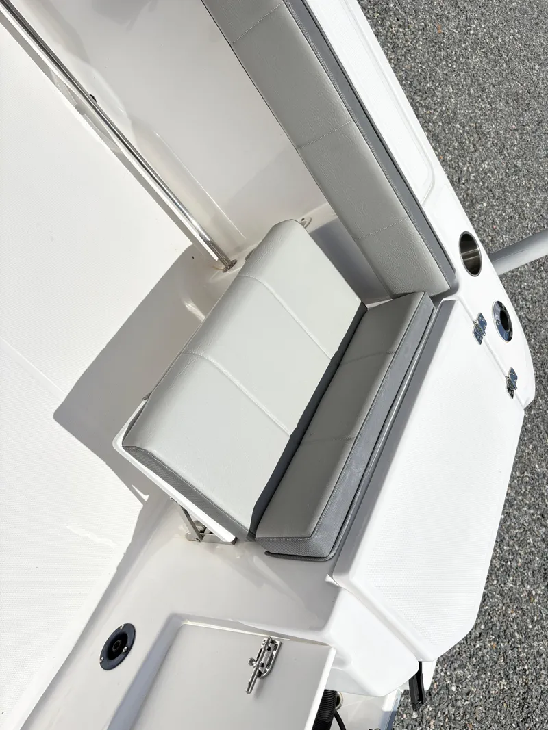 Slide: The Image of 2022 Aquasport 2300 CC boat seat with white and gray upholstery. - 15