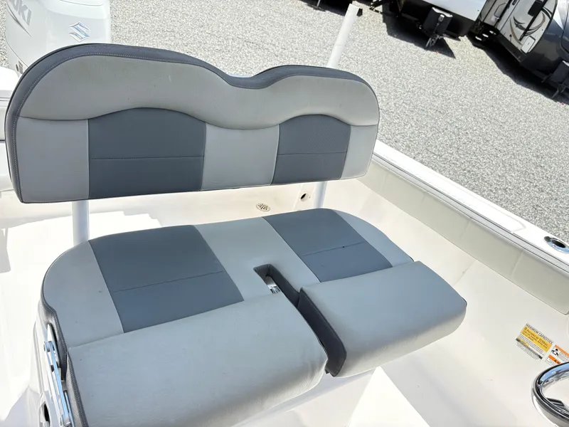 Slide: The Image of 2022 Aquasport 2300 CC boat seat with gray and black upholstery. - 16