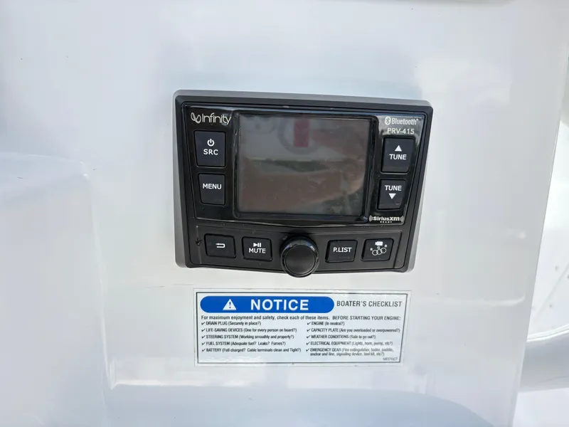 Slide: The Image of Infinity PRV-415 Bluetooth stereo on 2022 Aquasport 2300 CC boat with boater's checklist. - 20