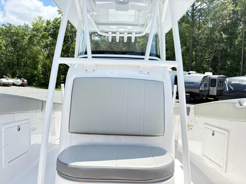 Slide: The Image of 2022 Aquasport 2300 CC boat interior with seating and storage compartments. - 23
