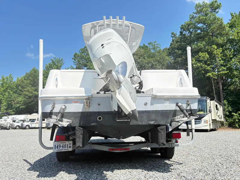 Slide: The Image of 2022 Aquasport 2300 CC boat on trailer, rear view, outdoors, sunny day. - 32