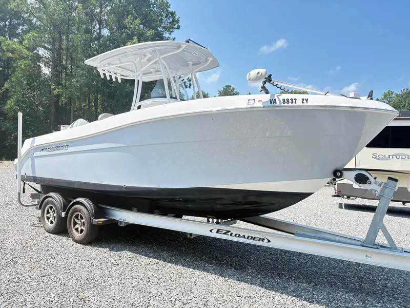 Slide: The Image of 2022 Aquasport 2300 CC boat on trailer, parked outdoors. - 34