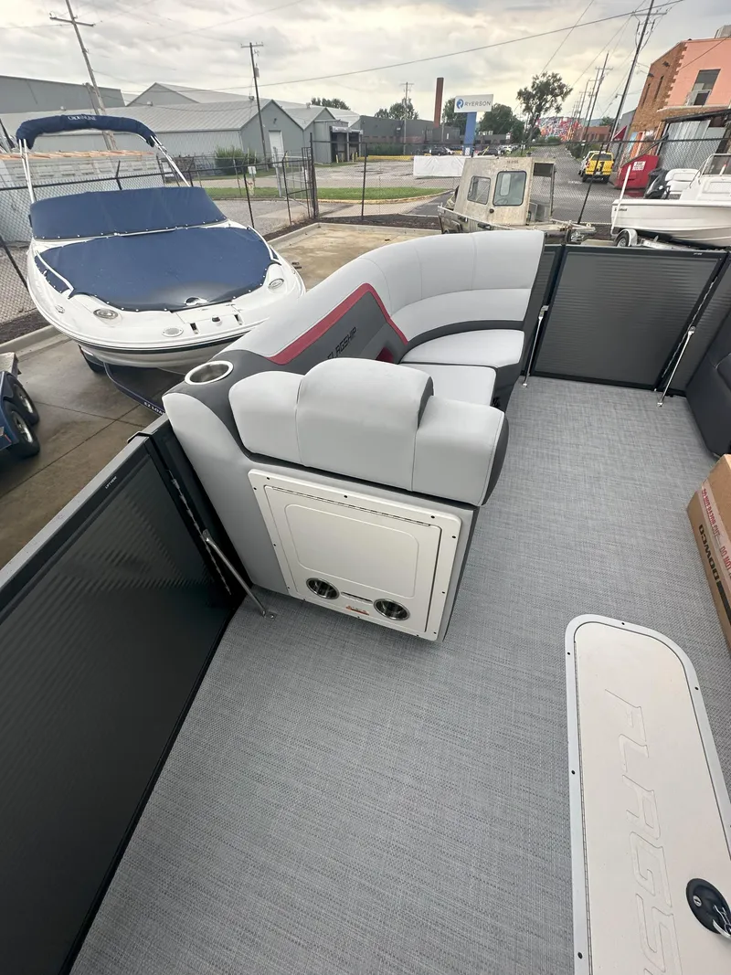 Slide: The Image of 2026 Flagship D22CU Extended Deck boat interior with seating and storage. - 13