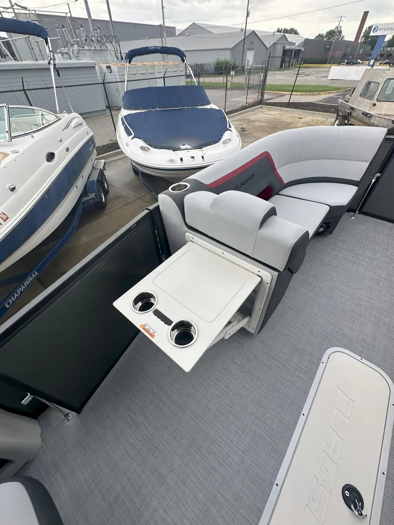 Slide: The Image of 2026 Flagship D22CU Extended Deck boat interior with seating and cup holders. - 14