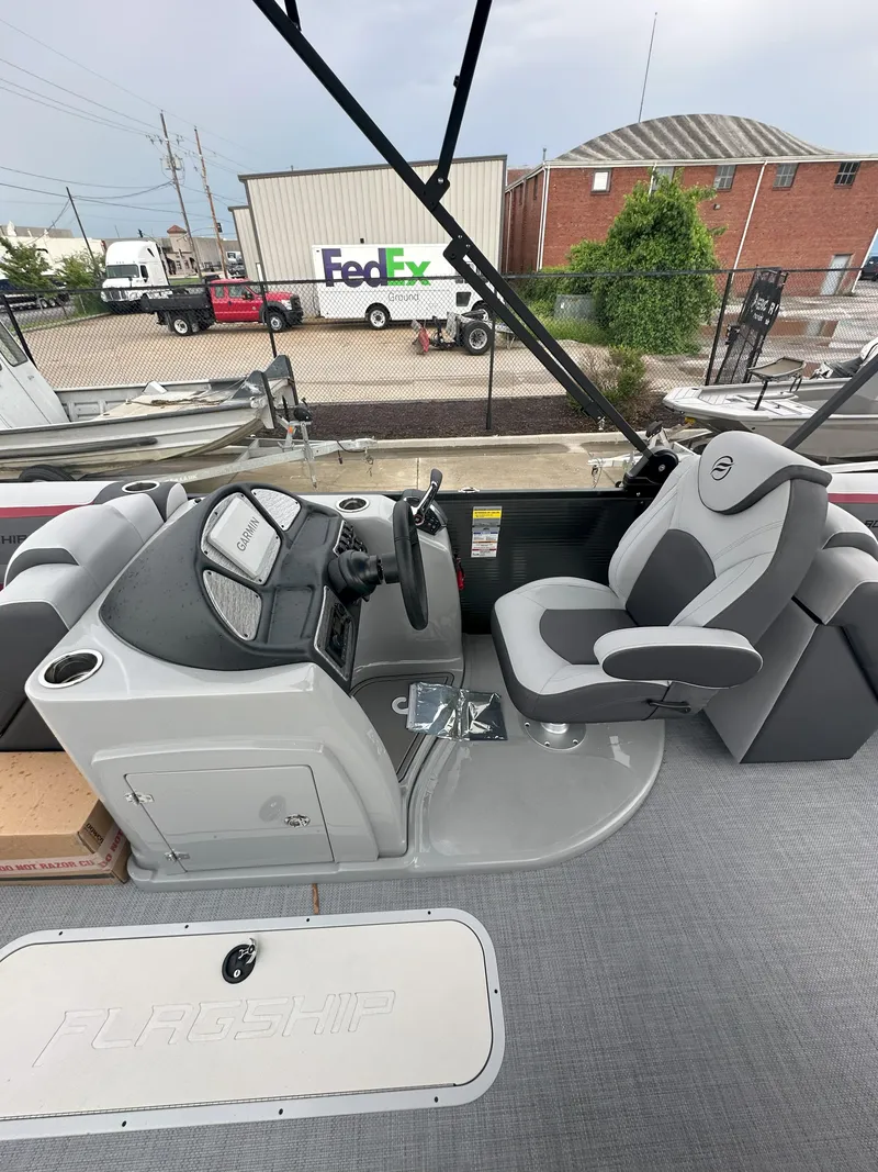 Slide: The Image of 2026 Flagship D22CU Extended Deck boat interior with steering console and captain's chair. - 5