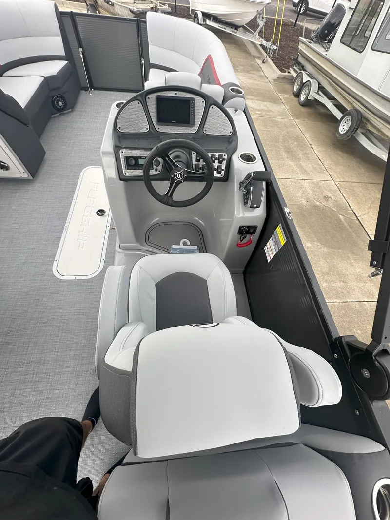 Slide: The Image of Interior view of 2026 Flagship D22CU Extended Deck boat with modern helm and seating. - 6