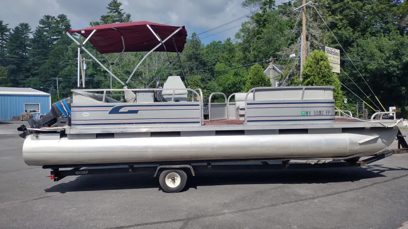 Slide: The Image of 1991 Grumman Funship 24' pontoon boat with canopy on trailer. - 4