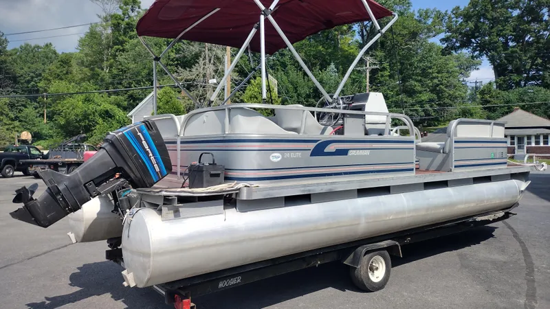 Slide: The Image of 1991 Grumman Funship 24' pontoon boat with canopy and outboard motor on trailer. - 5