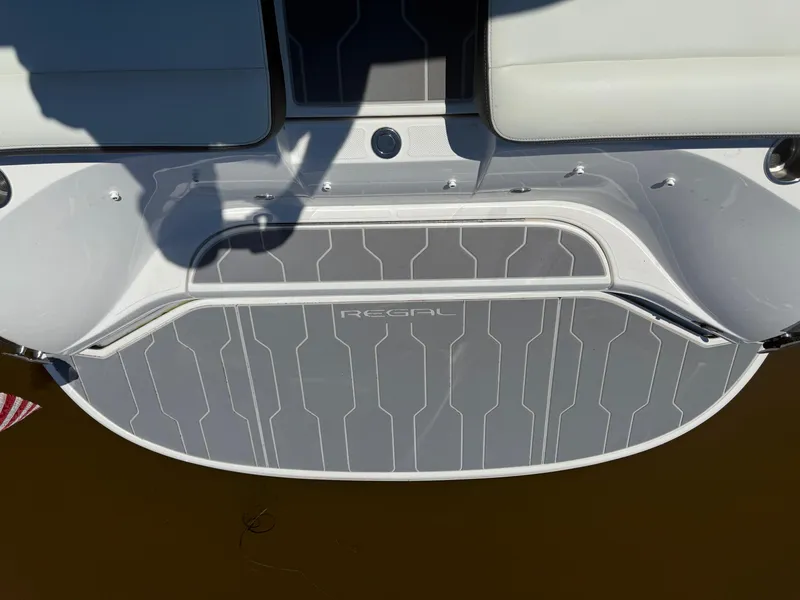 Slide: The Image of 2023 Regal 2800 Bowrider boat deck with sleek design and branding. - 16
