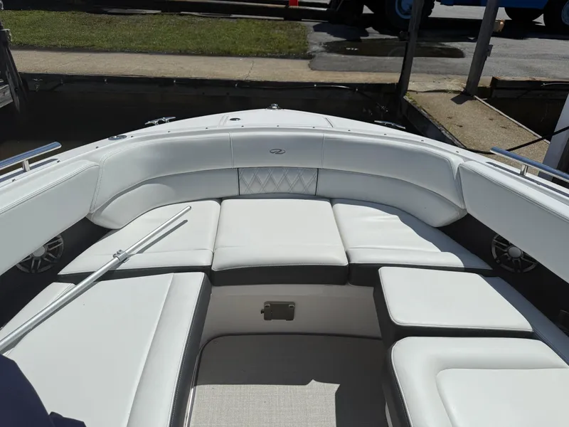 Slide: The Image of 2023 Regal 2800 Bowrider boat with luxurious white seating and spacious bow area. - 17