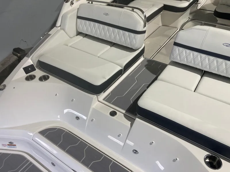 Slide: The Image of 2023 Regal 2800 Bowrider interior with white cushioned seating and sleek design. - 3