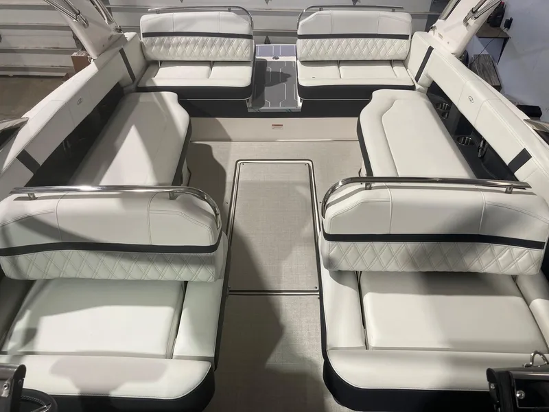 Slide: The Image of 2023 Regal 2800 Bowrider interior with luxurious white seating and elegant design. - 4