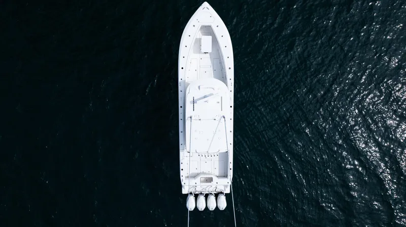 Slide: The Image of Aerial view of 2021 SeaVee 390 boat on dark water. - 21