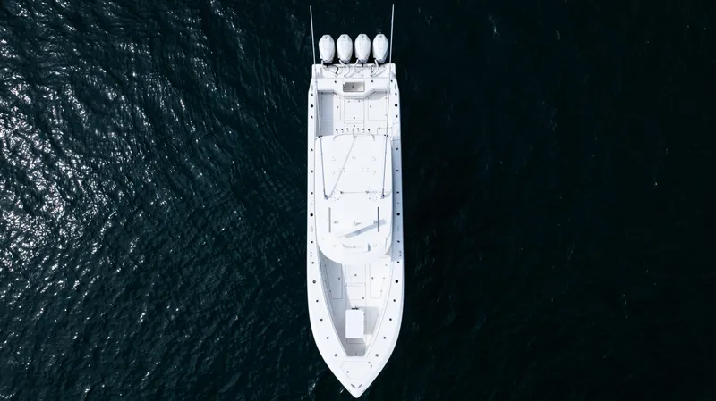 Slide: The Image of Aerial view of 2021 SeaVee 390 boat on dark water. - 22