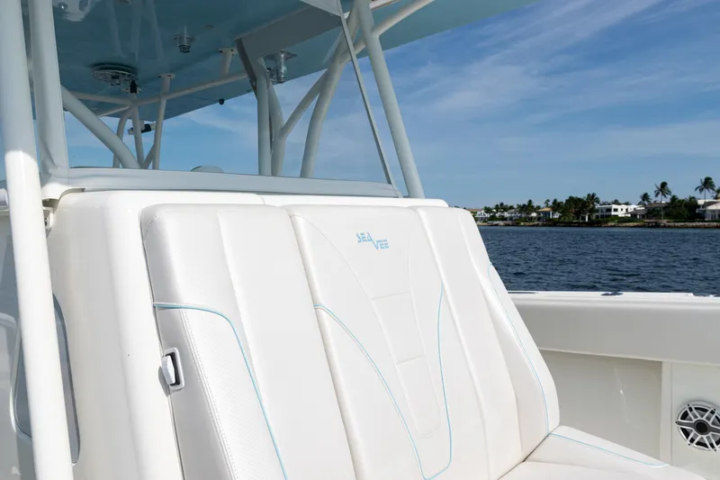 Slide: The Image of 2021 SeaVee 390 boat seat with ocean view and coastal background. - 38