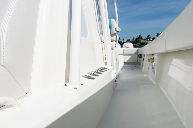 Slide: The Image of 2021 SeaVee 390 boat deck with white seating and clear blue sky. - 42