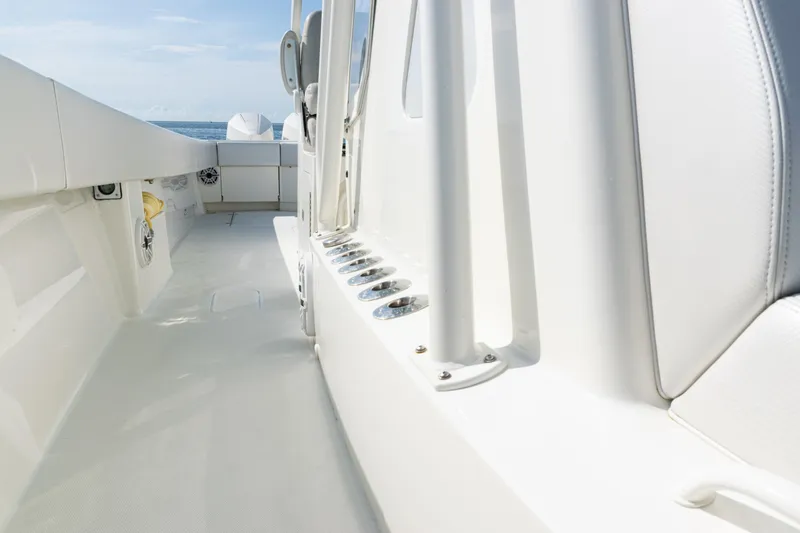 Slide: The Image of 2021 SeaVee 390 boat interior with rod holders and ocean view. - 44