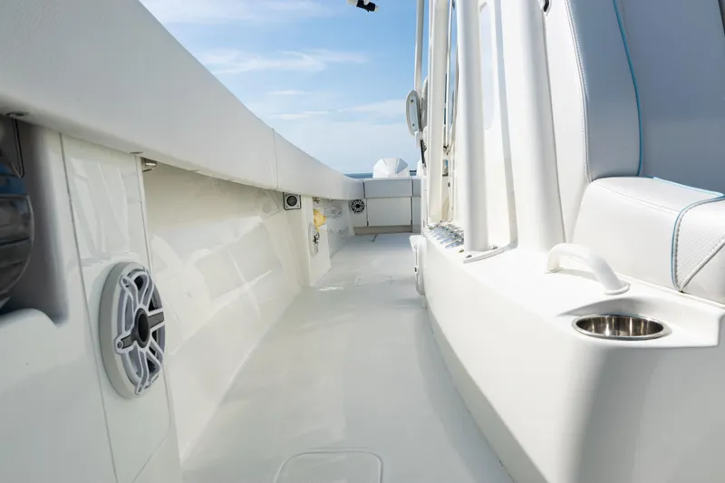Slide: The Image of 2021 SeaVee 390 boat interior with white seating and cup holder, showcasing sleek design. - 45