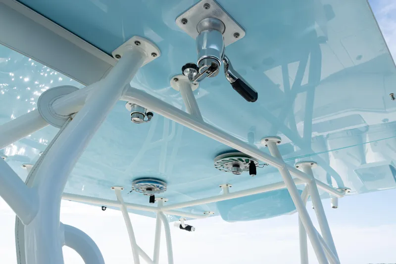 Slide: The Image of 2021 SeaVee 390 boat's blue T-top with mounted equipment and supports. - 47