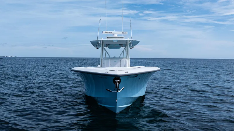 Slide: The Image of 2021 SeaVee 390 boat on open water, clear sky background. - 6