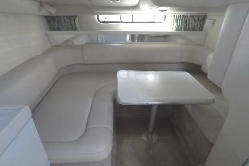 Slide: The Image of 2003 Formula 31 Performance Cruiser interior with beige seating and table. - 13