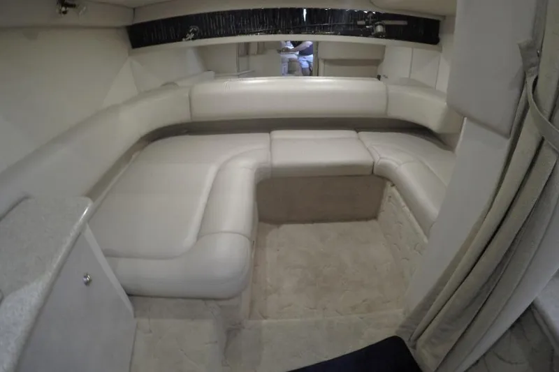Slide: The Image of 2003 Formula 31 Performance Cruiser interior with beige seating and carpet. - 14
