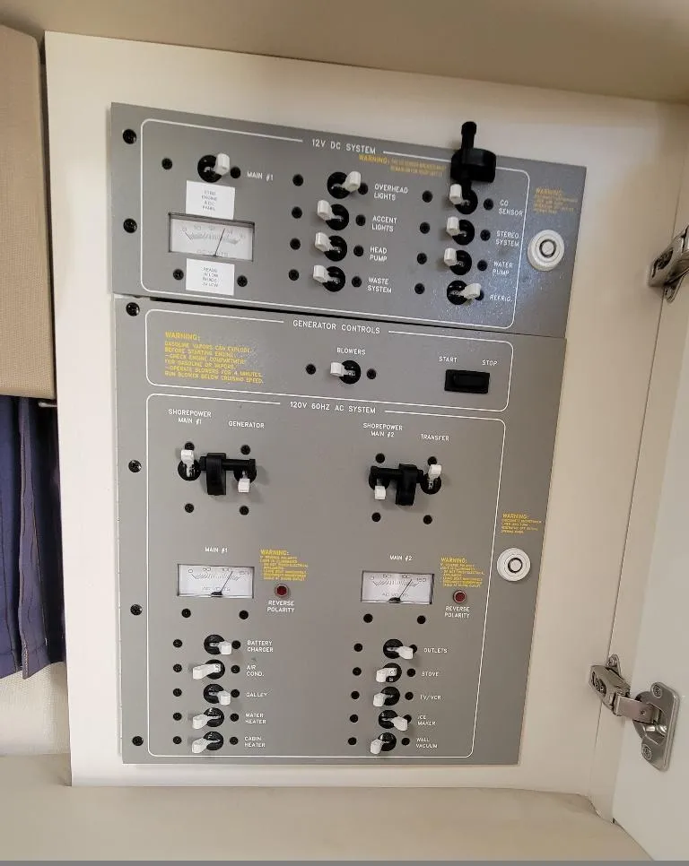 Slide: The Image of Control panel of a 2003 Formula 31PC boat with switches and indicators. - 19