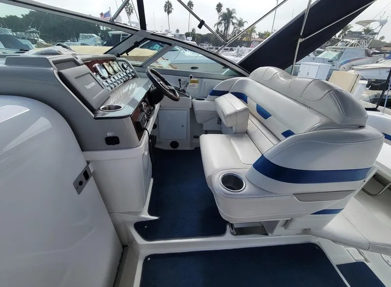 Slide: The Image of Interior of a 2003 Formula 31PC boat with white and blue seating. - 4