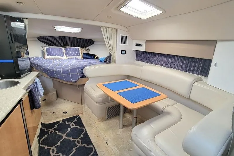 Slide: The Image of Interior of a 2003 Formula 31 Performance Cruiser with cozy seating and sleeping area. - 8
