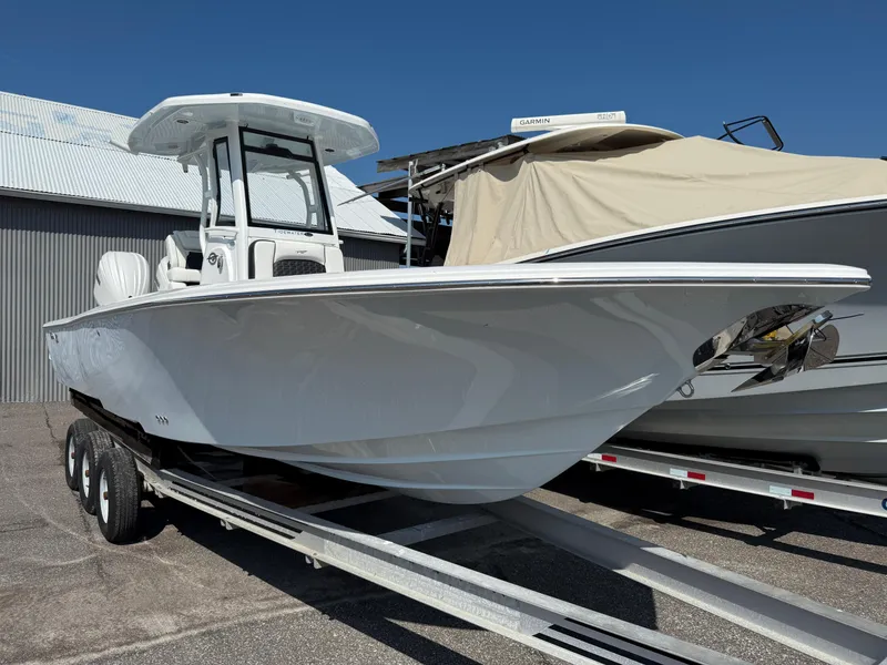 Slide: The Image of 2026 Tidewater 2700 Carolina Bay boat on trailer, parked outdoors. - 3