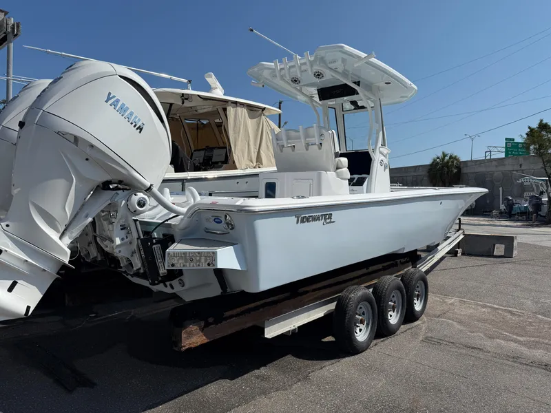 Slide: The Image of 2026 Tidewater 2700 Carolina Bay boat on trailer with Yamaha engine, parked outdoors. - 4