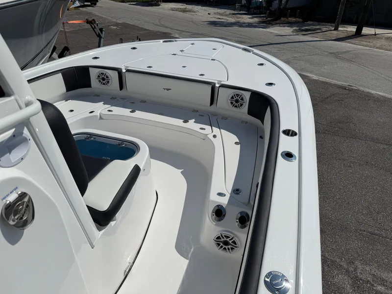 Slide: The Image of 2026 Tidewater 2700 Carolina Bay boat interior with seating and storage compartments. - 7