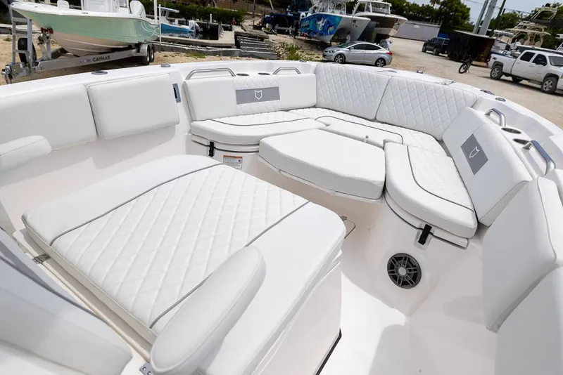 Slide: The Image of 2026 Sea Fox 268 Commander boat interior with white cushioned seating. - 16