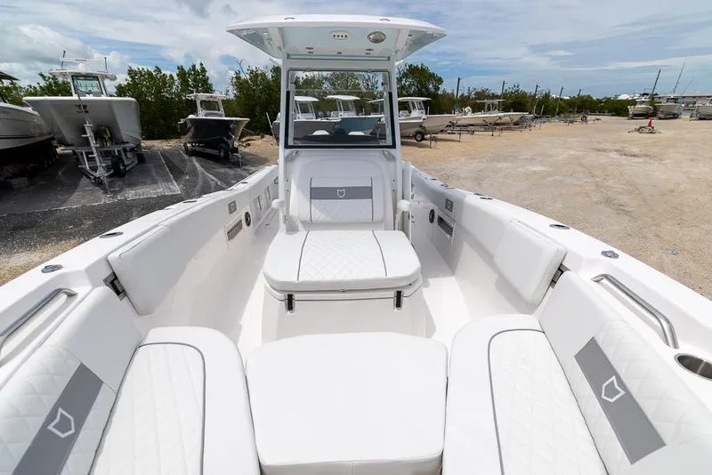 Slide: The Image of 2026 Sea Fox 268 Commander boat interior with white seating and open deck. - 18