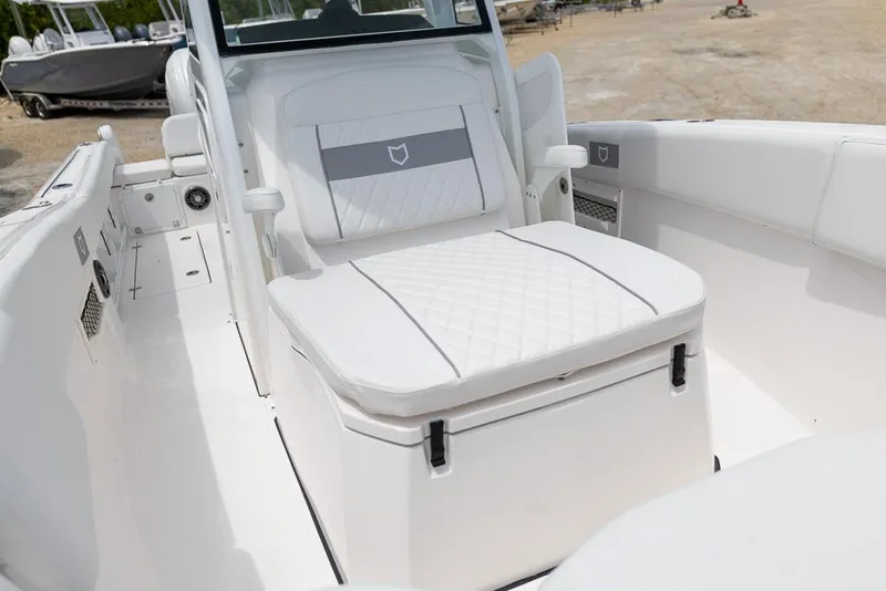 Slide: The Image of 2026 Sea Fox 268 Commander boat interior with white cushioned seating. - 19