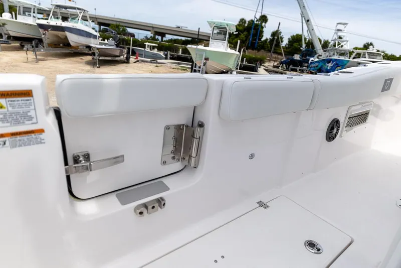 Slide: The Image of 2026 Sea Fox 268 Commander boat interior with open side door and seating. - 21