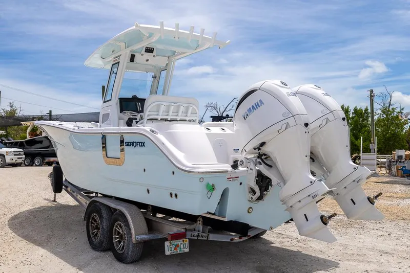 Slide: The Image of 2026 Sea Fox 268 Commander boat with dual Yamaha engines on a trailer. - 4