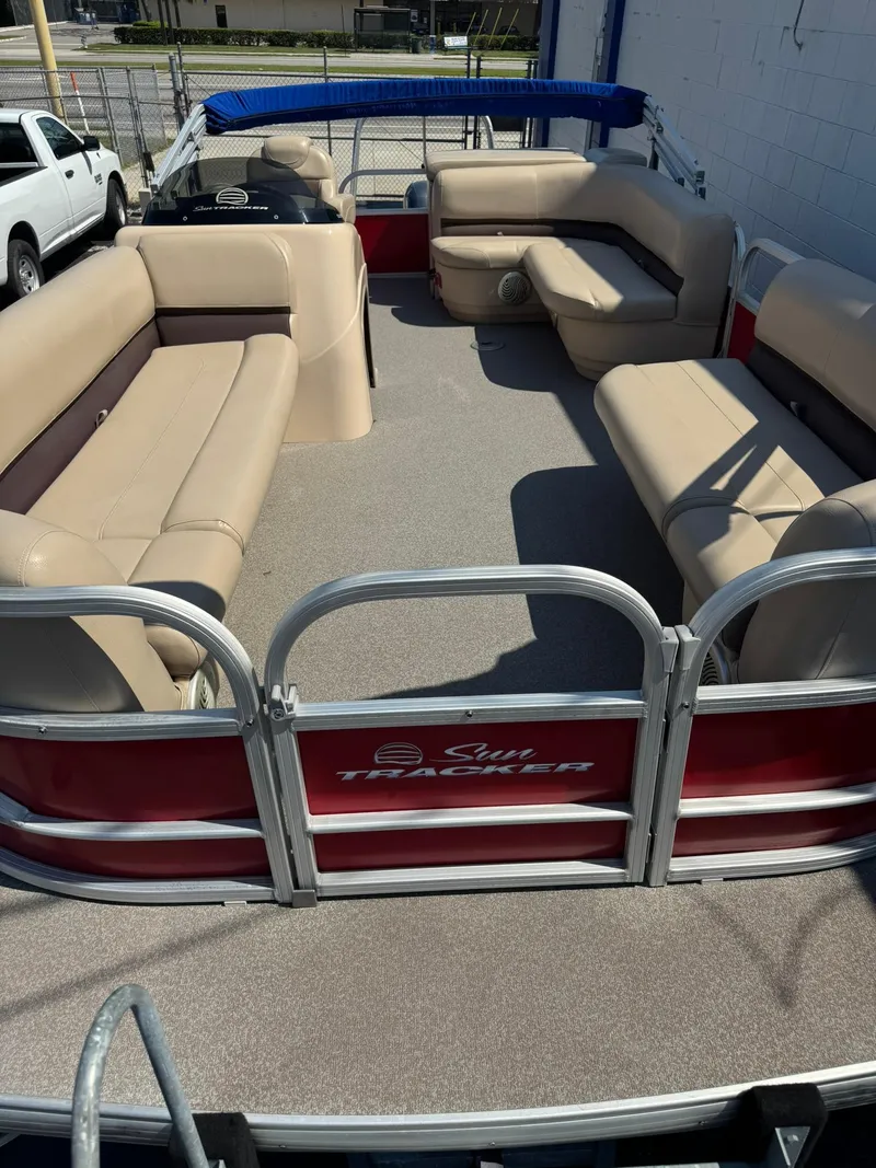 Slide: The Image of 2017 Sun Tracker Party Barge 20 DLX with spacious seating and beige upholstery. - 5