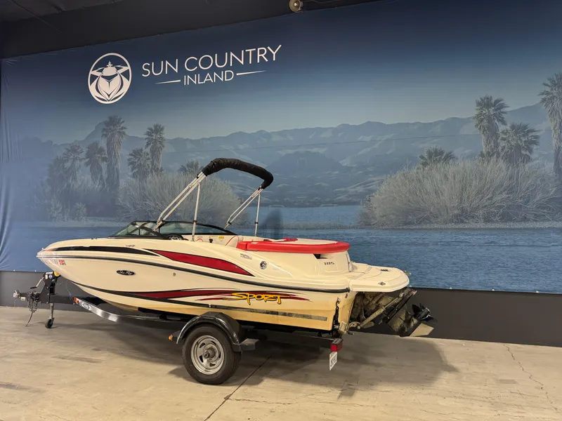 Slide: The Image of 2012 Sea Ray 185 Sport boat displayed indoors at Sun Country Inland. - 8