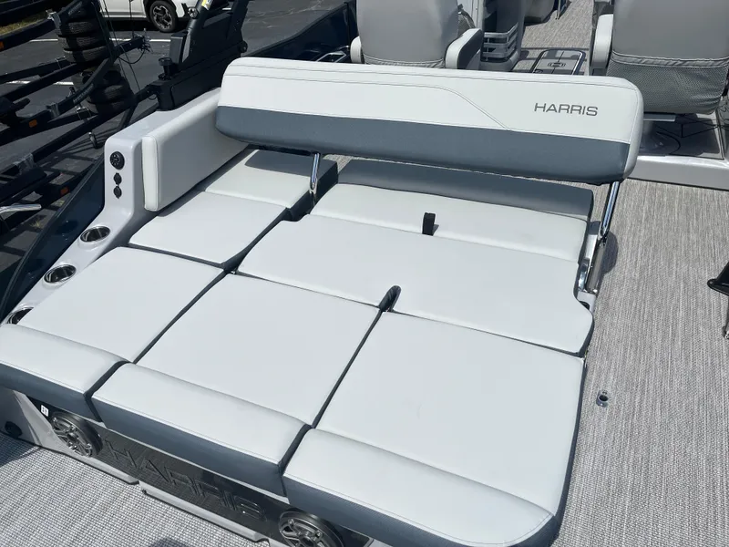 Slide: The Image of 2026 Harris Grand Mariner 230 boat interior with luxurious seating and cup holders. - 10