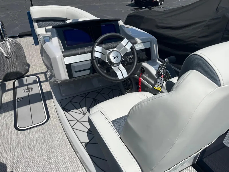Slide: The Image of 2026 Harris Grand Mariner 230 boat interior with modern dashboard and steering wheel. - 14