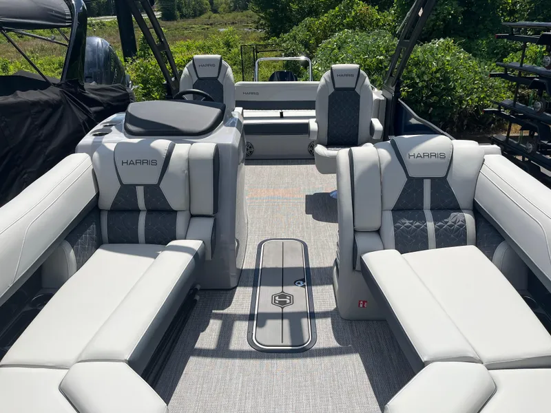 Slide: The Image of 2026 Harris Grand Mariner 230 pontoon boat interior with luxurious seating and modern design. - 6