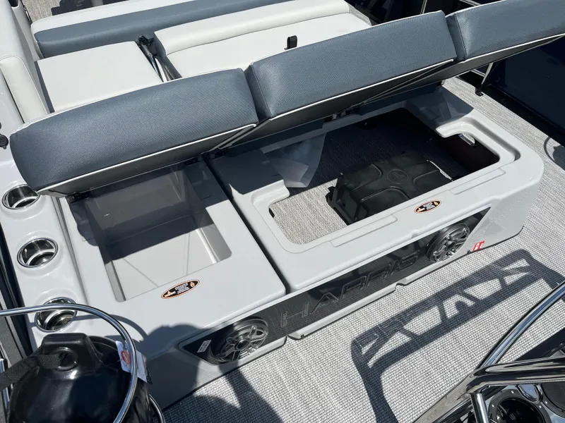 Slide: The Image of 2026 Harris Grand Mariner 230 boat interior with storage compartments and seating. - 8