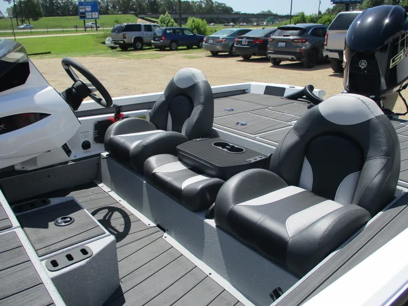 Slide: The Image of 2026 Vexus AVX1880 boat interior with sleek seating and modern dashboard. - 12