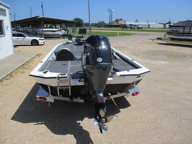 Slide: The Image of 2026 Vexus AVX1880 boat with Yamaha 115 engine, parked outdoors on gravel. - 4