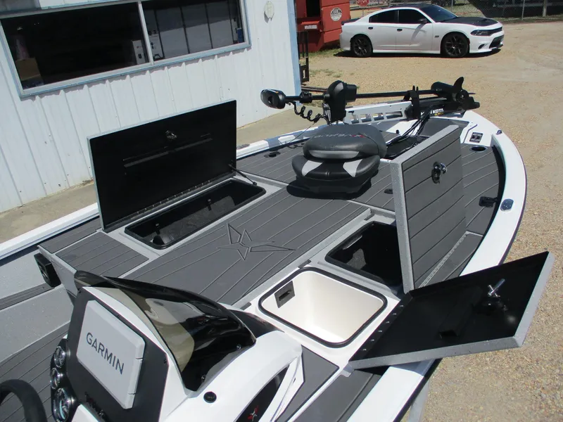 Slide: The Image of 2026 Vexus AVX1880 boat with Garmin electronics and open storage compartments. - 6